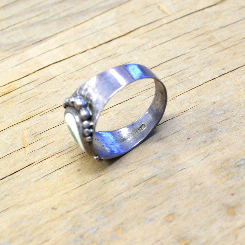 By eyeball silver ring...