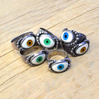 By eyeball silver ring...