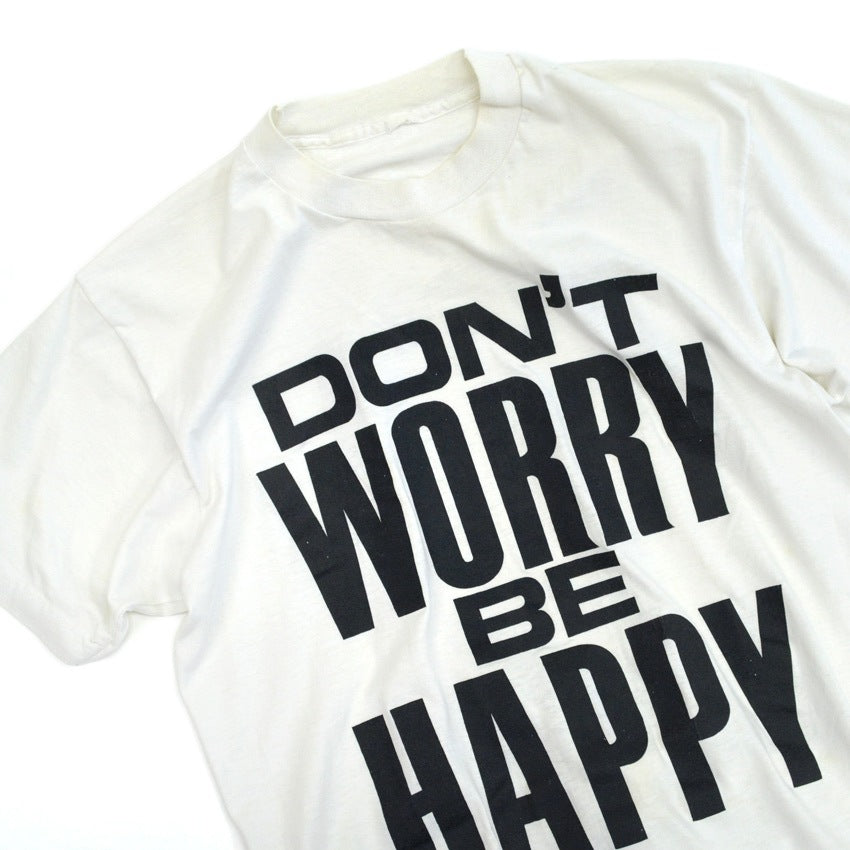 80s-era 'DON'T WORRY BE HAPPY' T-shirt...